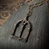 crowned queen isabella window amulet - antiqued bronze